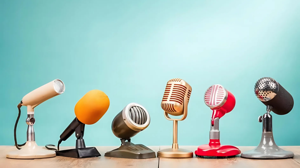 six microphones sitting on a desk